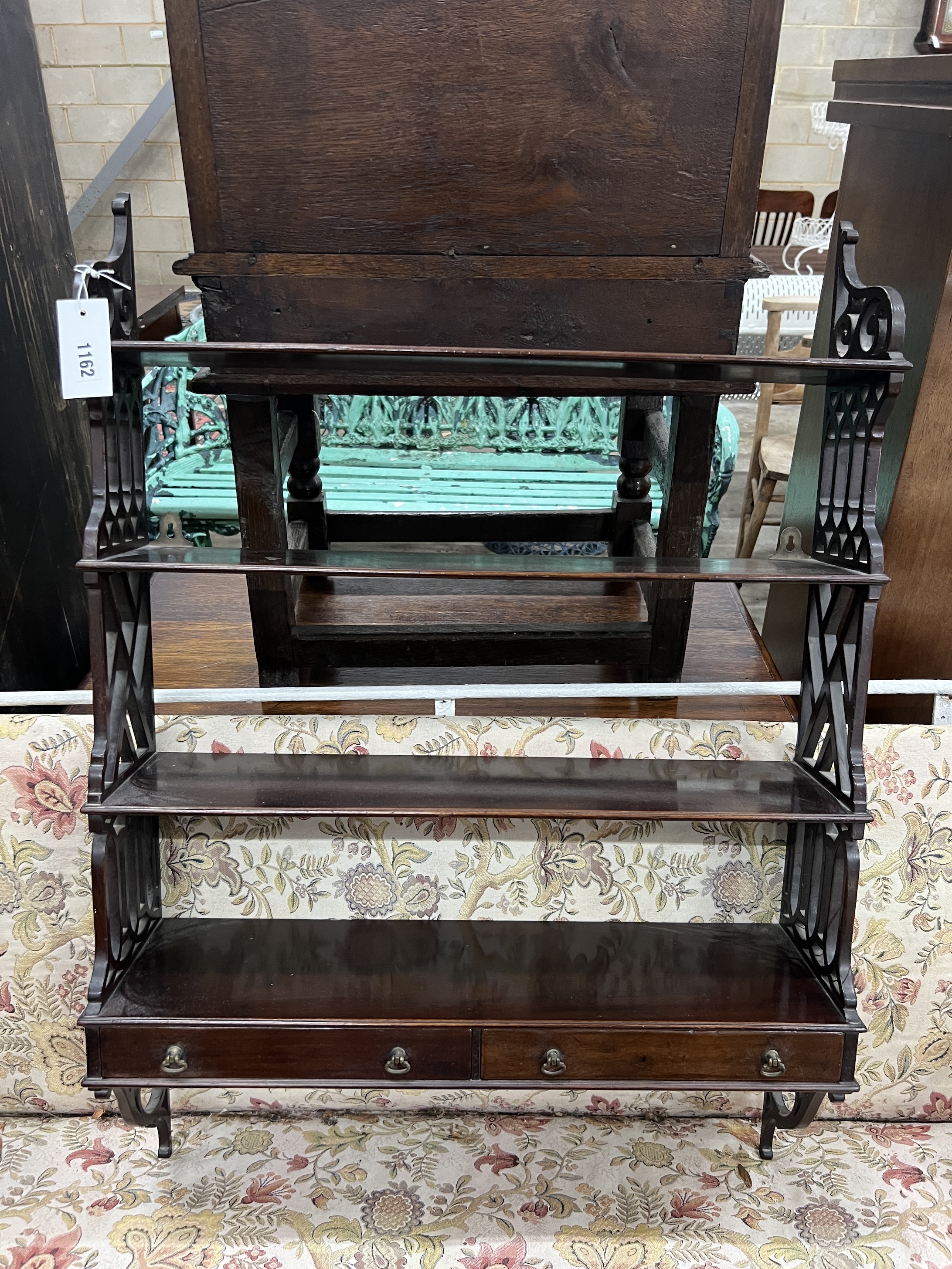 A reproduction George III style mahogany fretwork wall bracket, width 62cm, depth 17cm, height 88cm